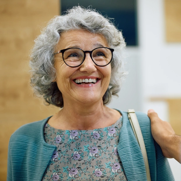 Smiling patient at Auburn Dentures & Implants