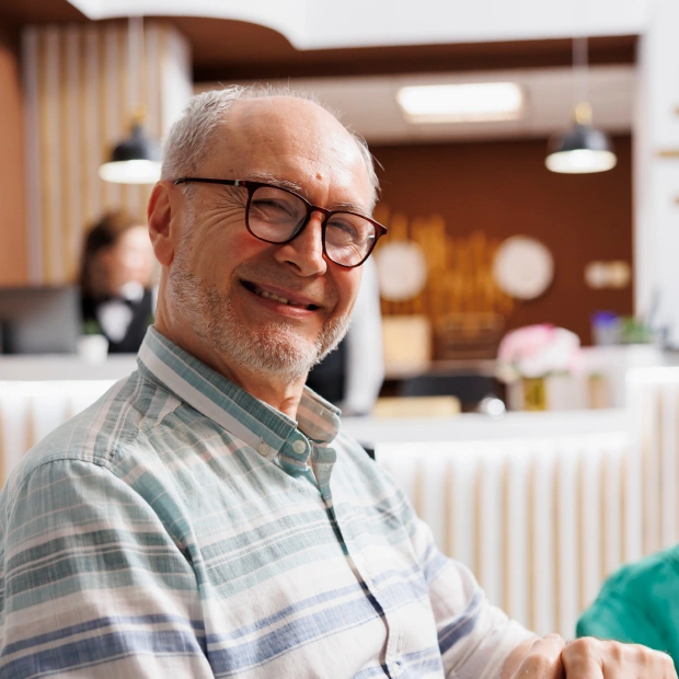 New patient smiling at Auburn Dentures & Implants